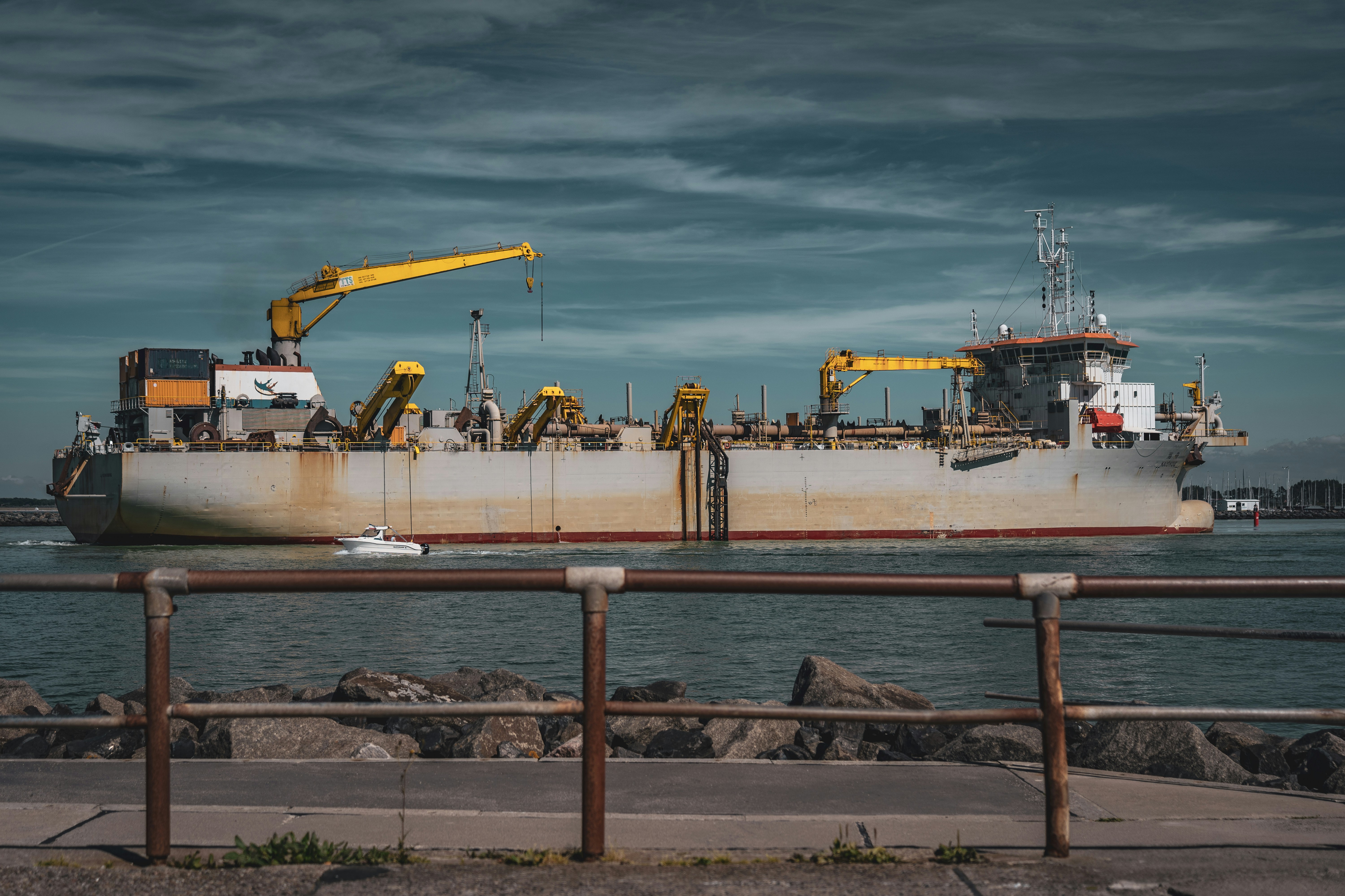 Modern dredger leaving harbour