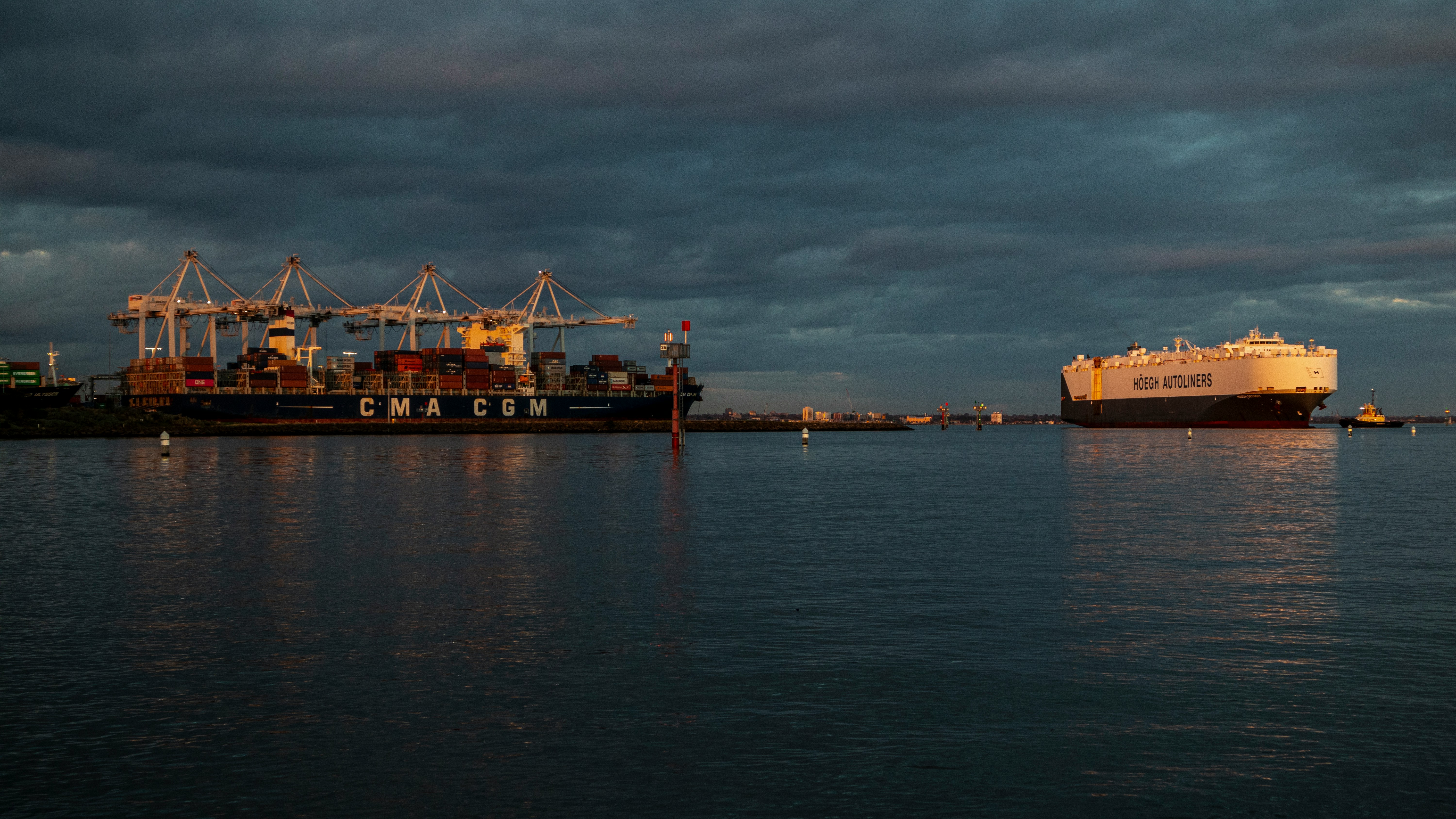 Container vessel and Hoegh Autoliner at dusk