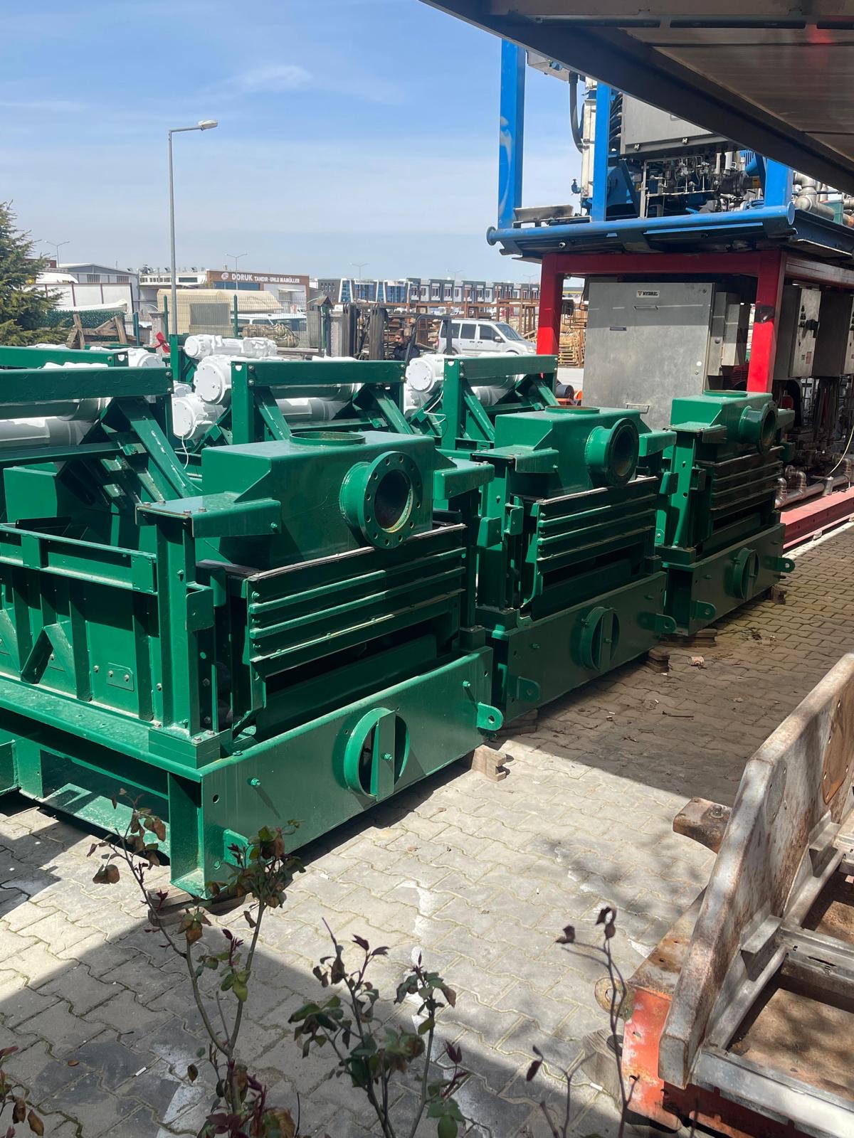 Multiple Derrick shakers lined up after refurbishment
